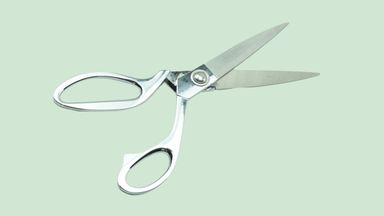 Scissor on gren background